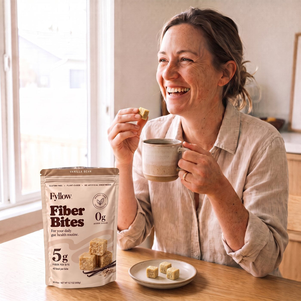 Woman enjoying a Fyllow Fiber Bite with her coffee