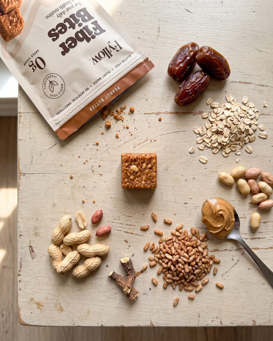 Peanut Butter Fiber Bites flatlay with dates, oats and peanuts
